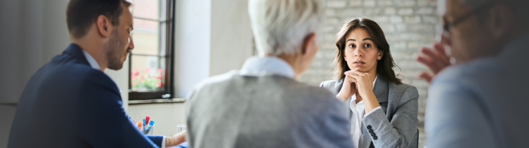 Mature female experiencing auditory neuropathy while at a job interview