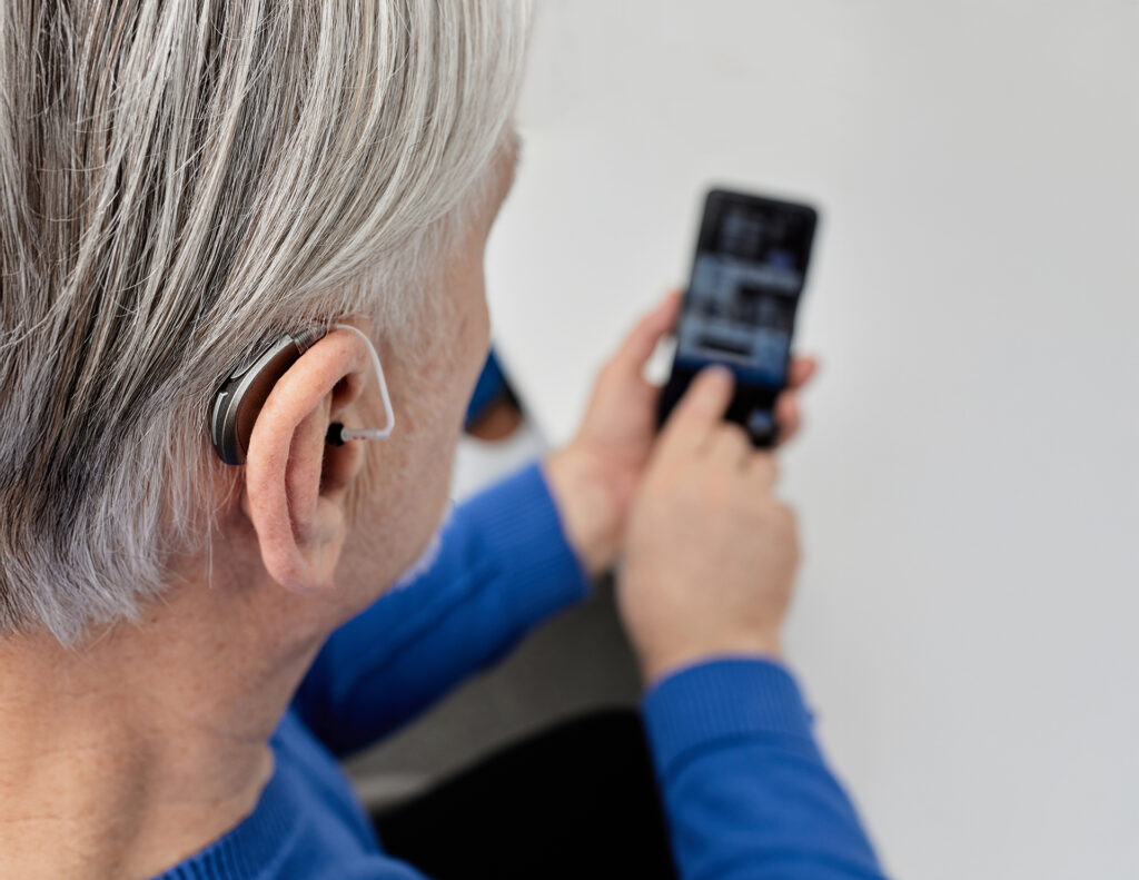 Changing your hearing aid's volume and programs